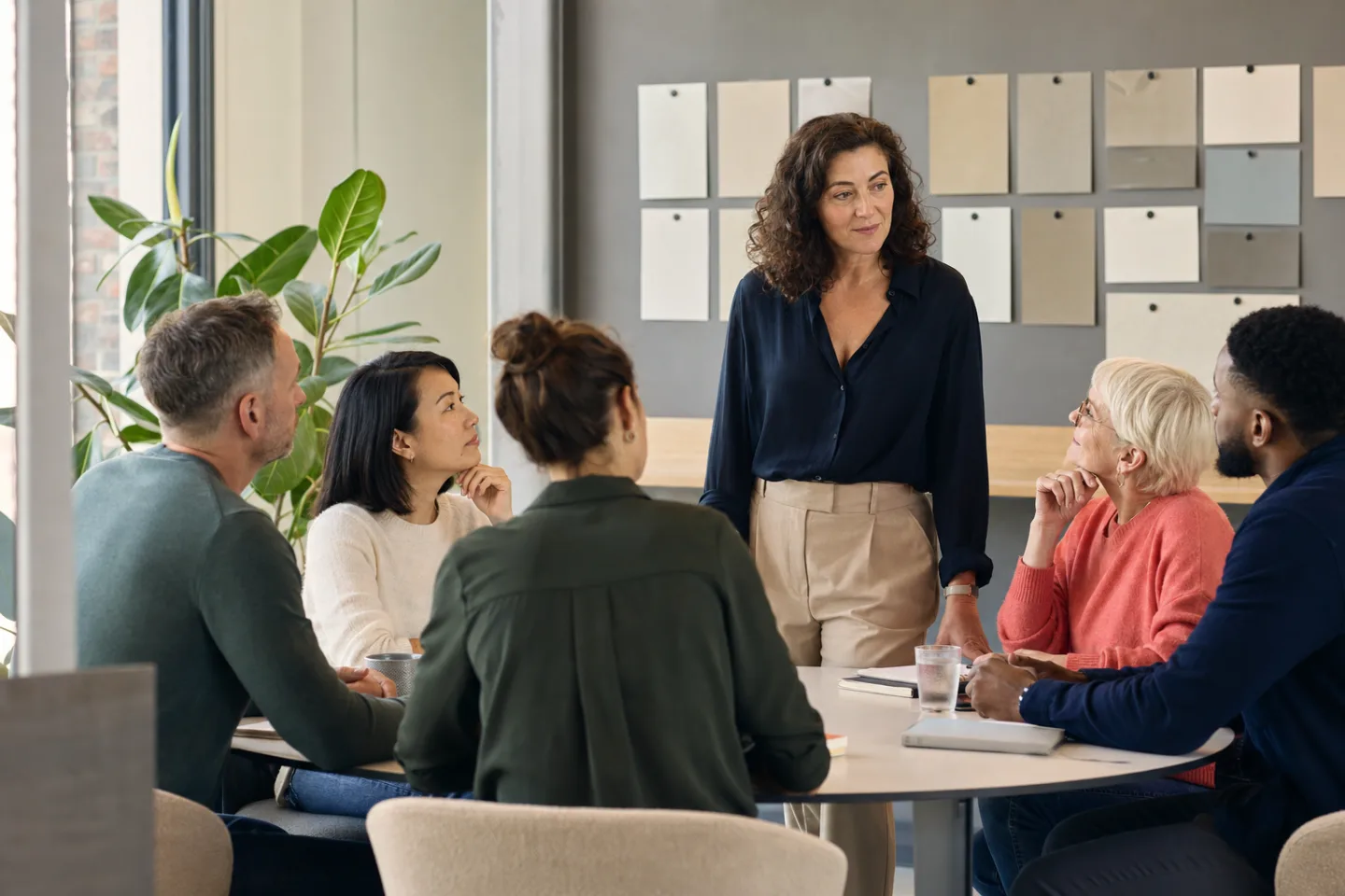 Colleagues discussing a workplace development plan around a table